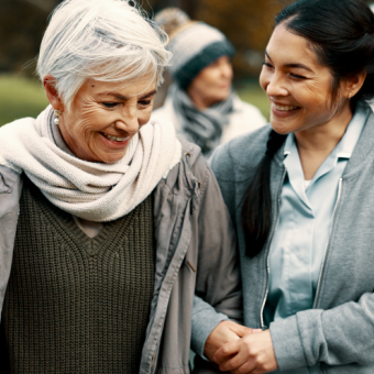 Woman helping senior citizen