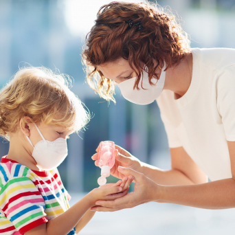 woman and child with masks