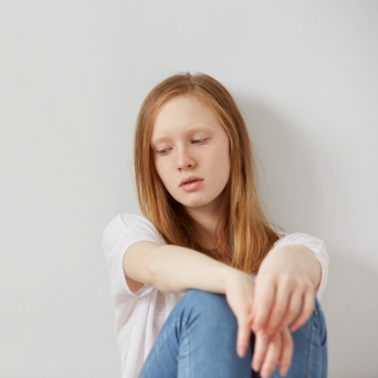 Teen Girl Sitting on the Floor