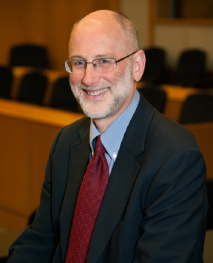 Headshot of Alan Tomkins