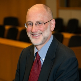 Headshot of Alan Tomkins