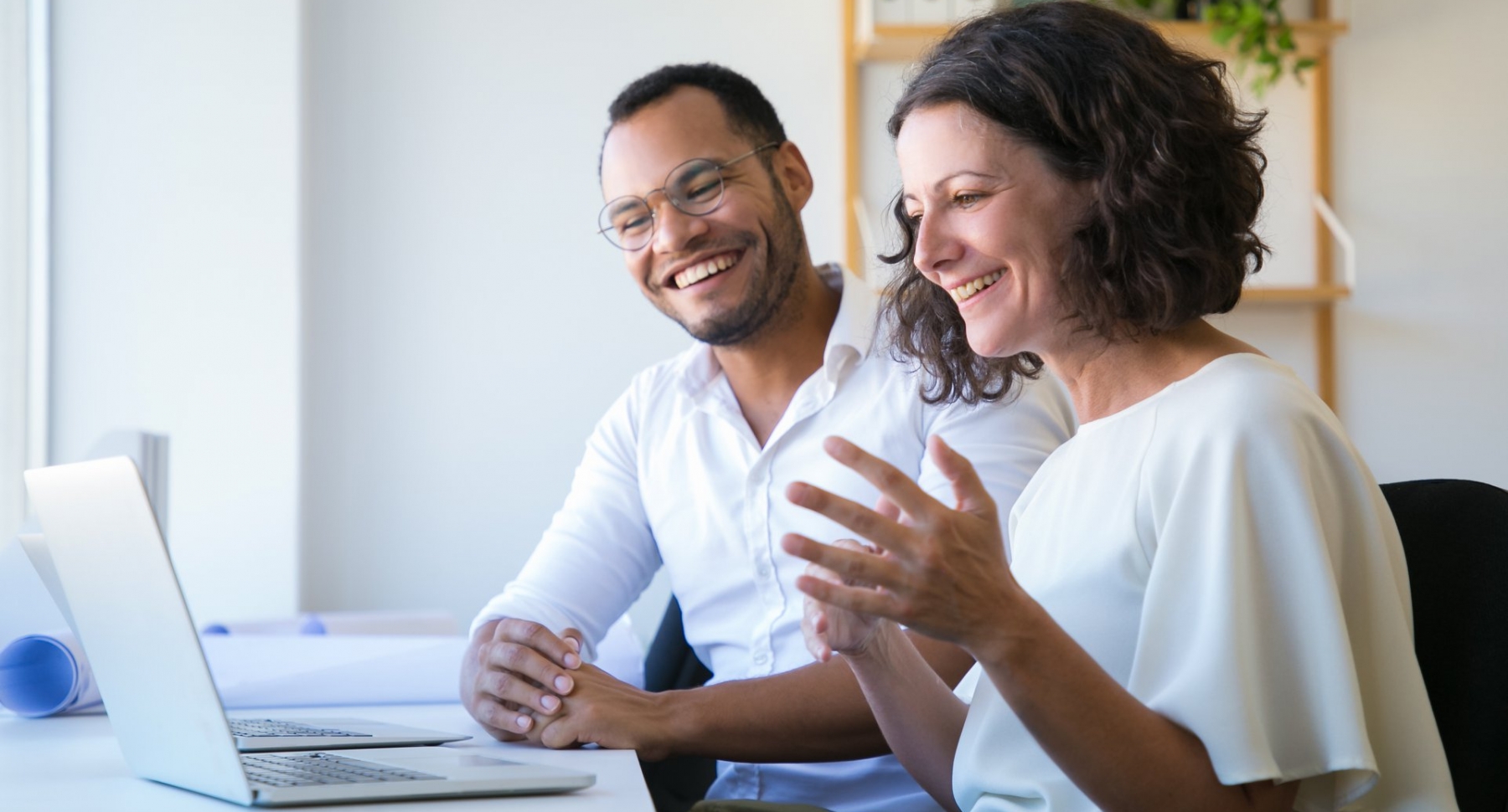 Colleagues working together and smiling