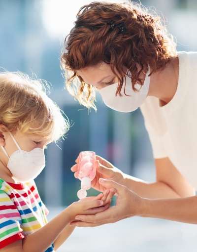 woman and child with masks